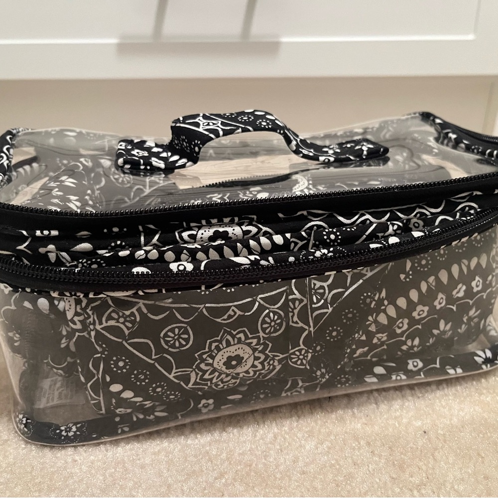 Vera Bradley 4 piece travel cosmetics bag.
